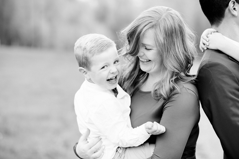 Children's portrait photography capturing joyful moments with family in outdoor settings.